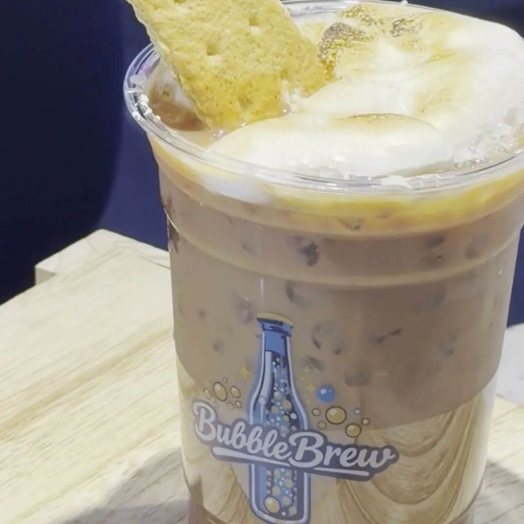 BubbleBrew iced coffee with a sweet cream-topped pastry