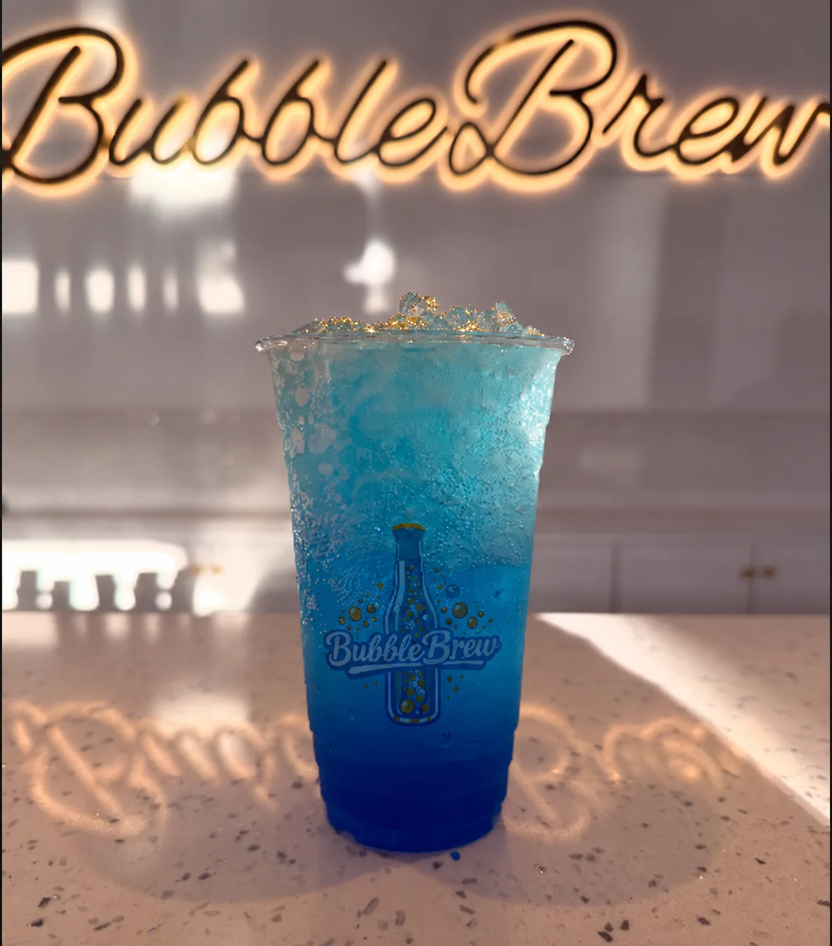 BubbleBrew blue signature soda with a sparkling top